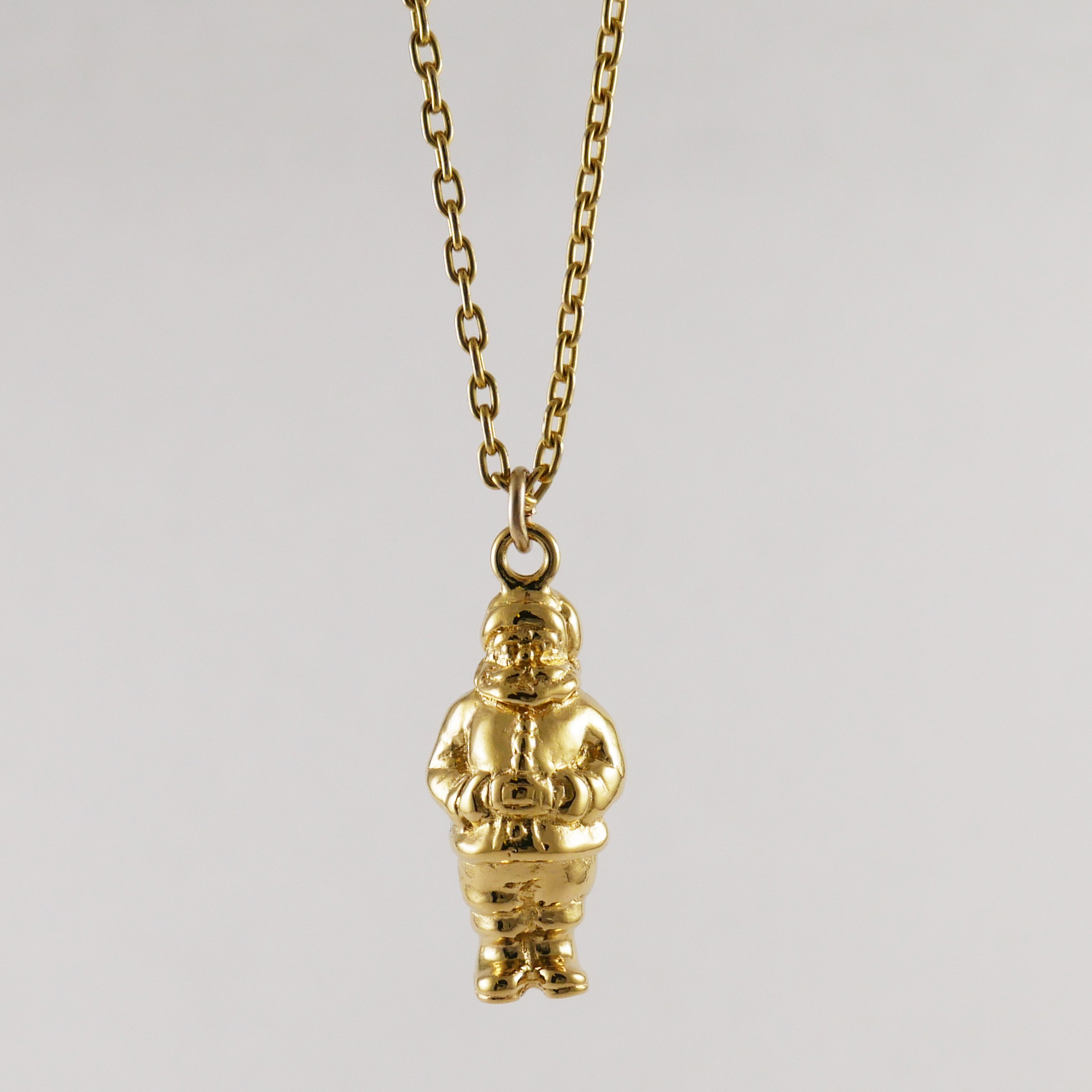 Gold Santa Claus pendant on a chain 